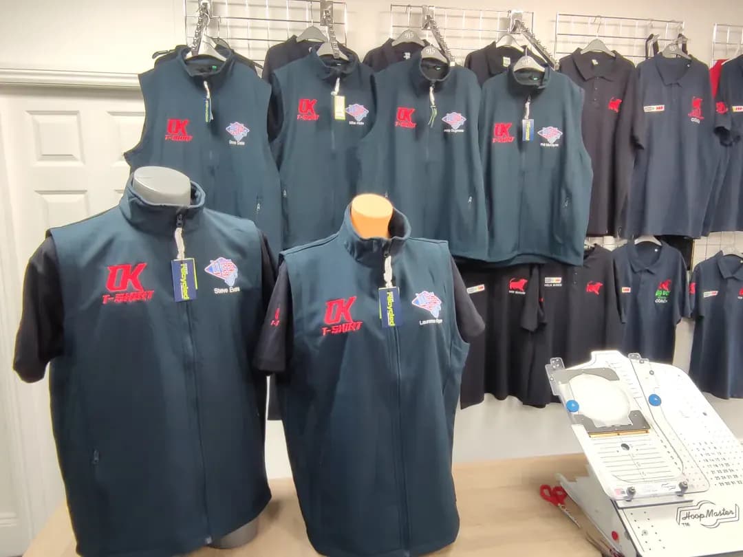 Green embroidered speedway team jackets displayed at OK T-Shirt Birmingham