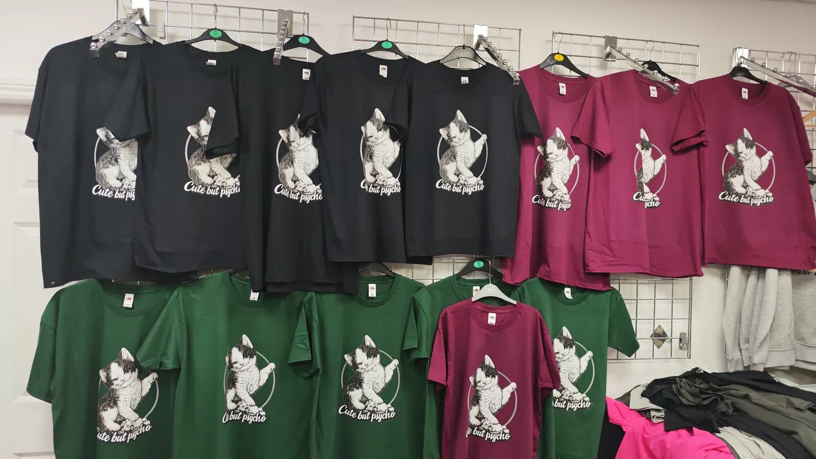 Cute But Psycho cat t-shirts prepared for a bulk printing order in Birmingham