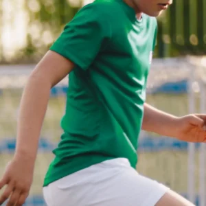 a boy wearing a green t-shirt
